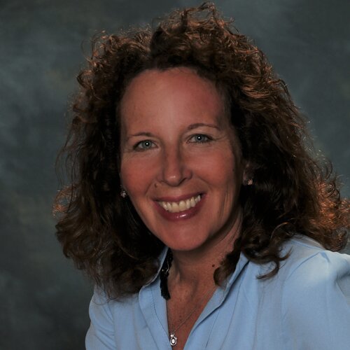 Professional portrait of Hillary Johns, Trial Lawyer, featured in a discussion about legal protection for business owners.